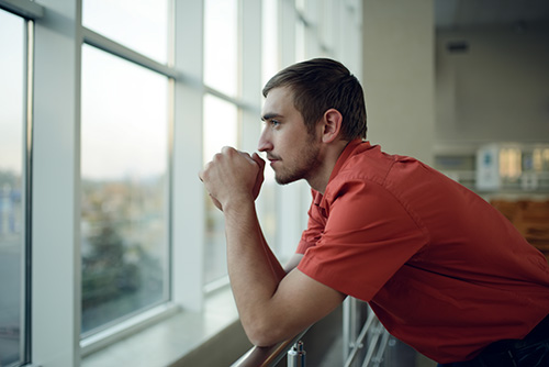 Man looking out window wonders what are dabs