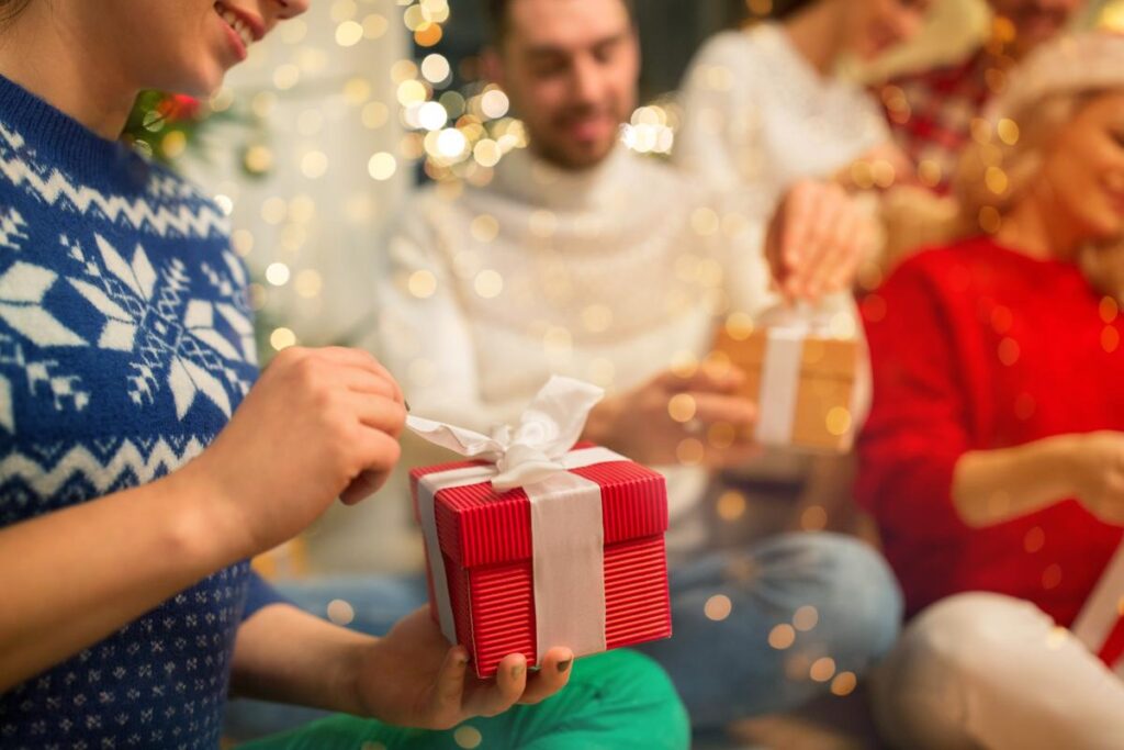 person opening gift works on enjoying sober holidays