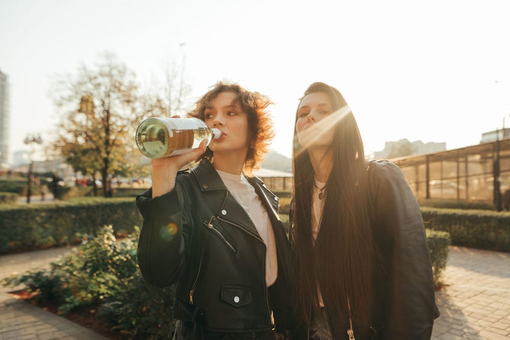 young women facing the dangers of binge drinking as they day drink