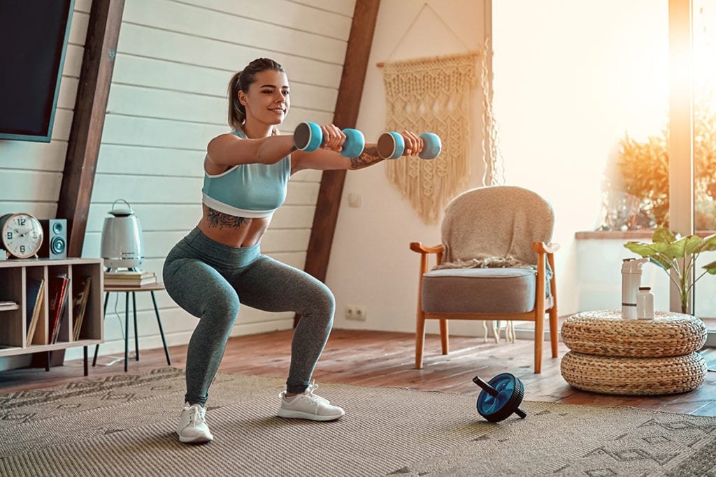 woman exercising after learning How to Fill Your Time Sober In Quarantine