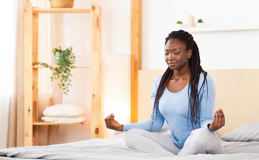 woman meditating using Relapse Prevention Techniques
