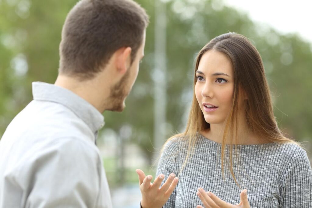 Woman talking to loved one, justifying her addiction