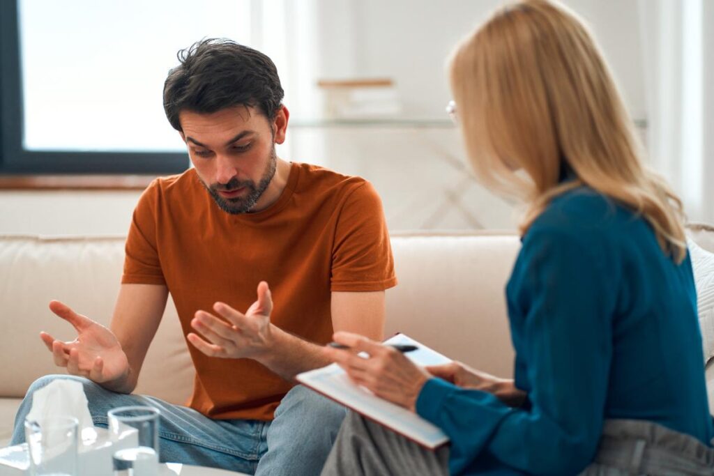 Patient talks to therapist while in a benzo rehab center