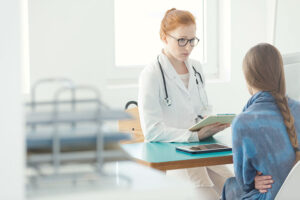 Patient talk to doctor as she begins an outpatient treatment program