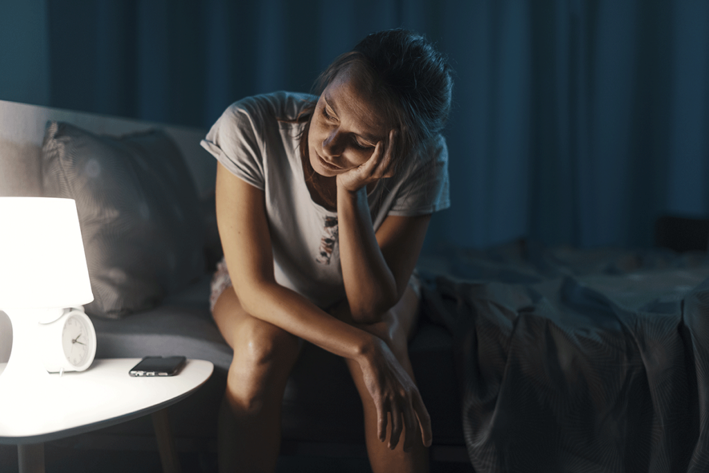Person thinking about the link between consuming alcohol and trauma issues