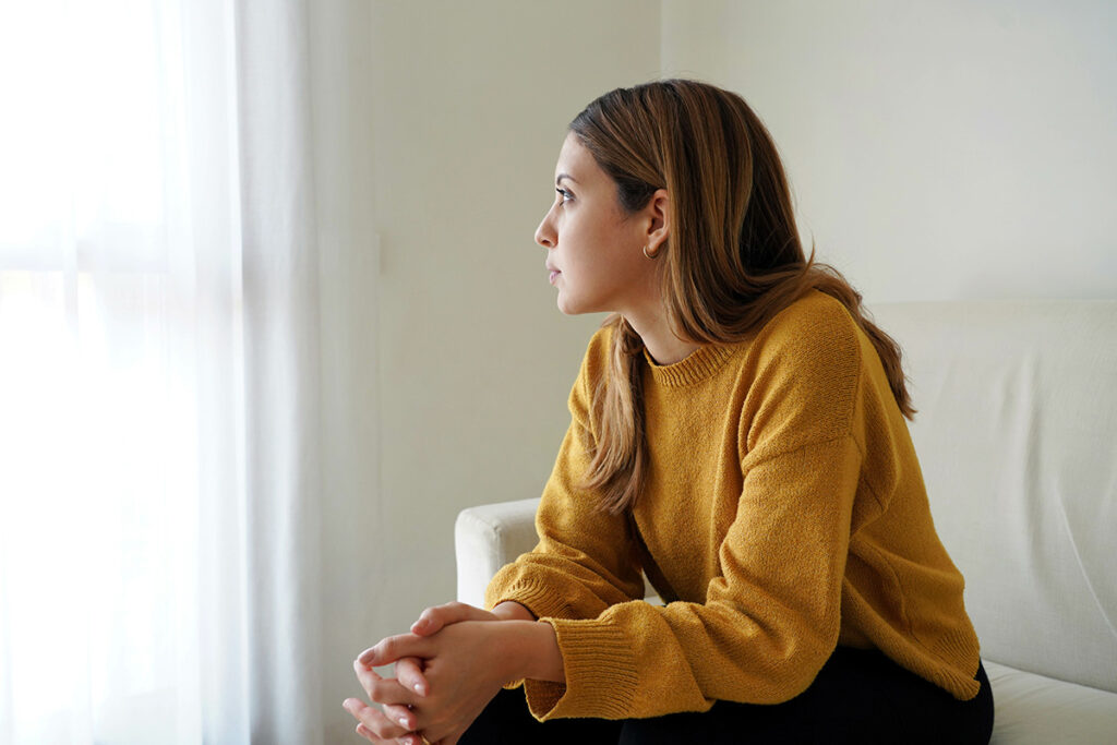 Person thinking about postpartum depression symptoms
